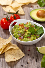 Guacamole with avocado, lime, tomato and cilantro