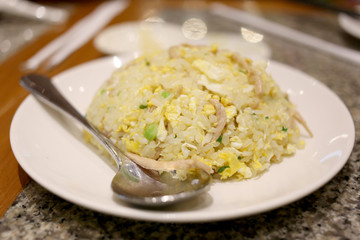 Fried rice on white dish.