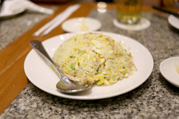 Fried rice on white dish.