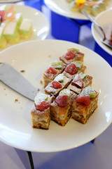 Fruit cake in white dish.