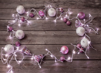Christmas lights on a wooden background with copy space