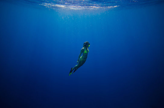 Girl Swimming Underwater