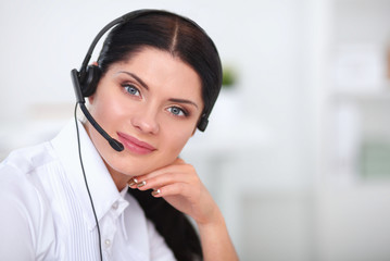 Portrait of beautiful businesswoman working at her desk with
