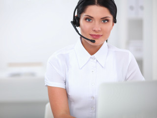 Portrait of beautiful businesswoman working at her desk with