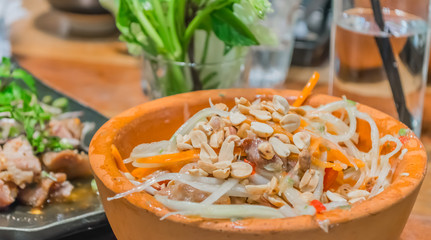 Thai style papaya salad in bowl