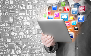Business man use tablet pc with colorful application icons