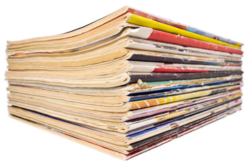 Pile of old magazines isolated on white