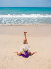 Fototapeta na wymiar girl sitting on a tropical beach