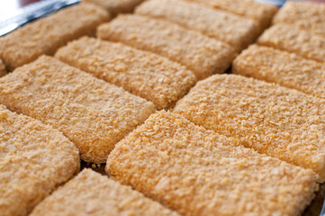 Cheese breaded in mixed cornflakes