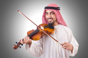 Arab man playing music on white