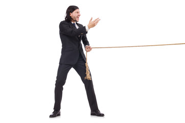 Young businessman pulling rope isolated on white