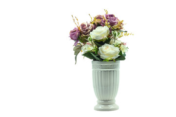 A bunch of flowers in a white vase against white background