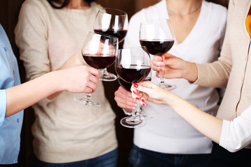 Woman hands with glasses of wine close-up