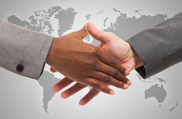 Handshake between business people of different ethnicity