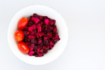 Salad of beetroot with oil and tomatoes