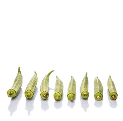 Okra or ladies' fingers vegetables over white background