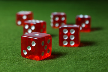 Six Red Dices Over Green Surface