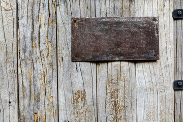 Old metal sign on wood background