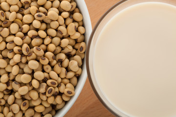 Soy milk in glass with soybeans