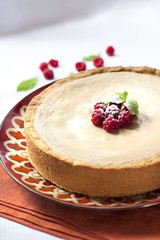 Coffee and cream cake with raspberries