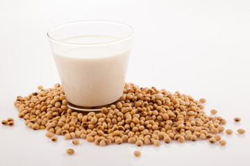 Soy milk in glass with soybeans