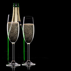 Champagne flutes on black background