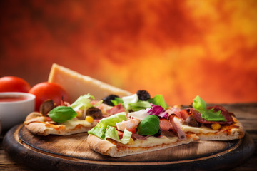 Delicious italian pizza served on wooden table