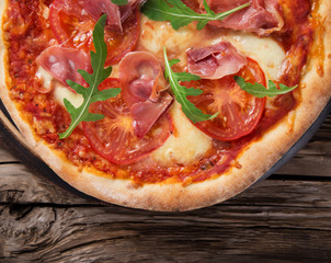 Delicious italian pizza served on wooden table