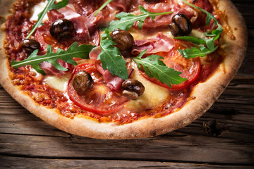 Delicious italian pizza served on wooden table