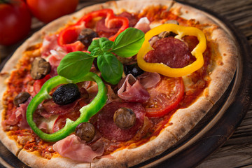 Delicious italian pizza served on wooden table