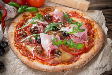 Delicious italian pizza served on wooden table