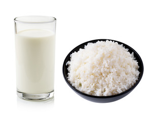 glass of milk and rice isolated on white