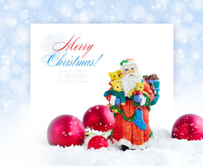 Santa Claus with Christmas decorations on a festive background