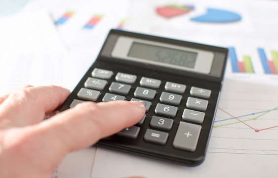 Businesswoman working with calculator