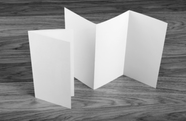 Blank folding page booklet on wooden background