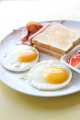 Breakfast with ham , fried egg and bread