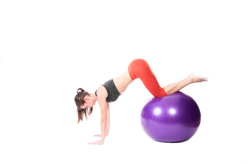 Doing push-ups on exercise ball