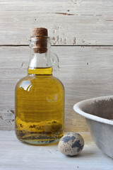 Fototapeta na wymiar Eggs, flour and a bottle of olive oil on the white wooden table