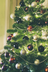 Obraz na płótnie Canvas Christmas tree with red, blac and silver ornaments