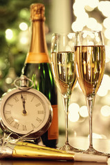 Fototapeta na wymiar Glasses of champagne with festive background