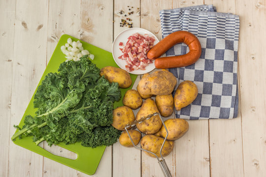 Ingredients to make typical dutch boerenkool with kale cabbage a