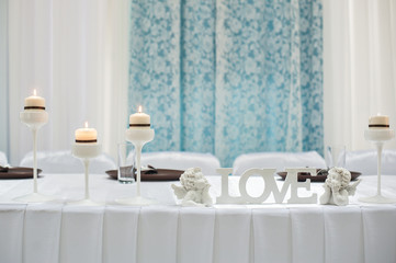 table setting for a holiday with the letters LOVE