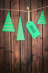 Merry Christmas tag on wooden surface
