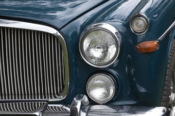 Obraz na płótnie Canvas Closeup of Chrome Grille and Lights of Restored Classic Car