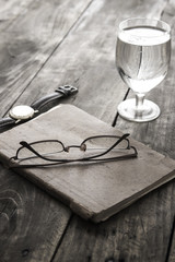 Fototapeta na wymiar writing concept: glasses, notes, glass of water