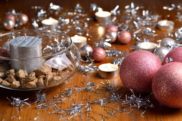 Christmas decoration with christmas bulbs, candles and tinsel
