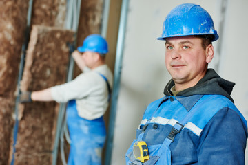 Construction worker at insulation work
