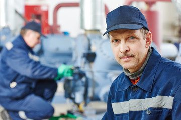 service engineer worker at industrial compressor station