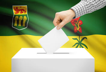 Ballot box with national flag on background - Saskatchewan