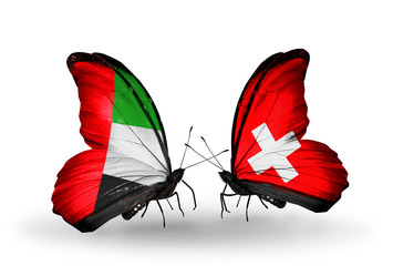 Two butterflies with flags UAE and Switzerland